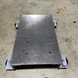 Pressure washing skid plate